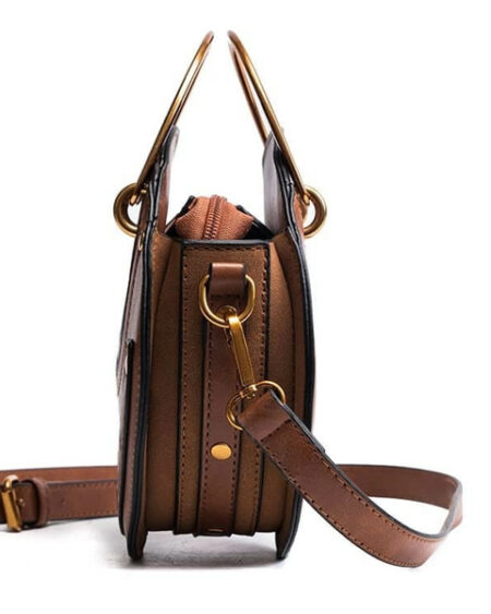 sac rond en bandoulière simili cuir, cuir vegan et clouté