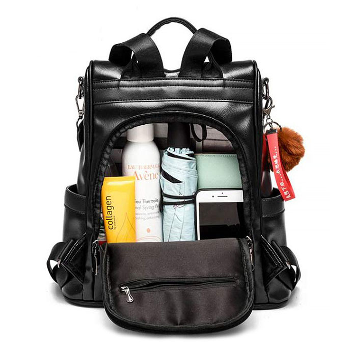 Sac à dos antivol femme BLAIR en cuir noir, convertible, avec pompon.